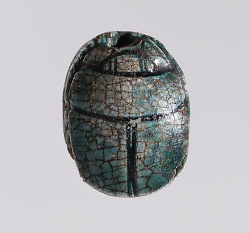 Scarab depicting a kneeling man (?)